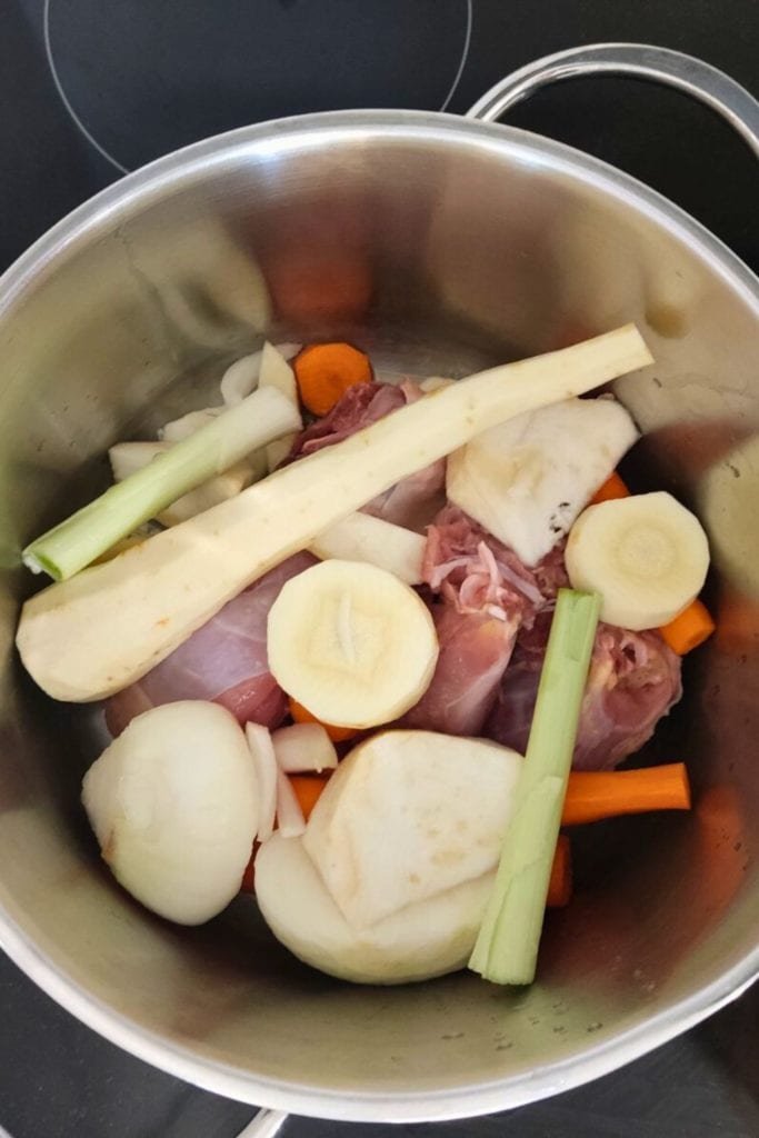Chicken stock ingredients in pot